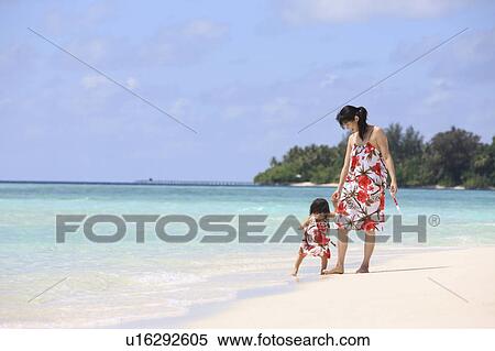 Mother and daughter at the beach, Maldive Islands View Large Photo Image Stock Photography - Mother and daughter at the beach, Maldive Islands. Fotosearch