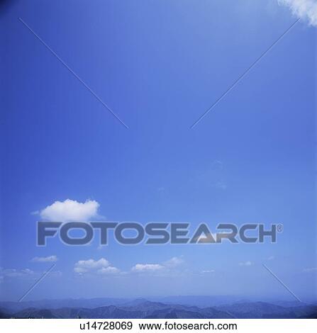 Stock Photo - Mountain range and sky . Fotosearch
