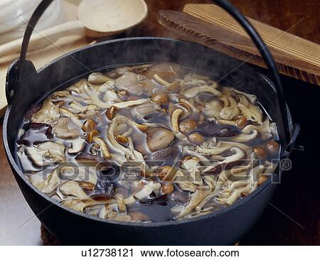 Stock Image - Mushrooms in a pot. Fotosearch