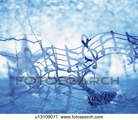 Stock Image - Musical note streamer with branch and a pine cone. Fotosearch