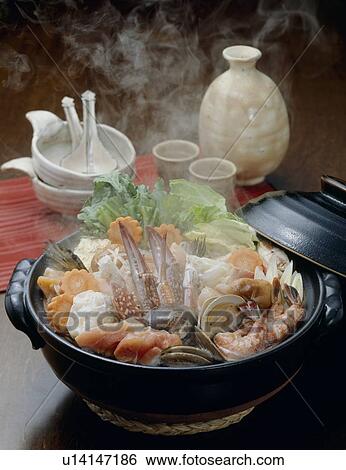 Stock Photograph - Nabe (Hot pot) with seafood and vegetables. Fotosearch