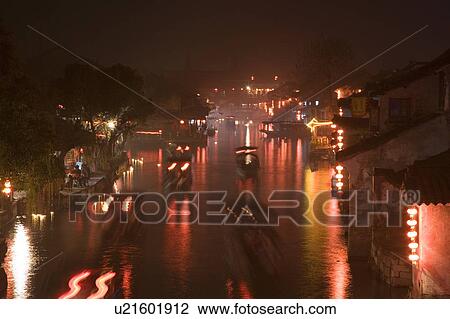 Stock Image - Nightscape of boating excursion, Xi Tang, China. Fotosearch