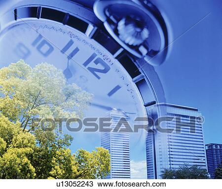 Stock Image - Office building and clock - digital composite. Fotosearch
