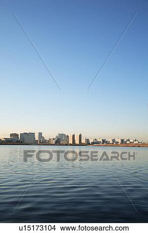 Picture - Office buildings and Tama river, copy space, Kawasaki city, Kanagawa prefecture, Japan. Fotosearch