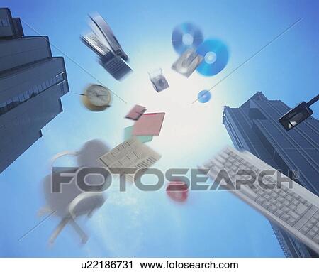 Stock Image - Office items flying through the air. Fotosearch