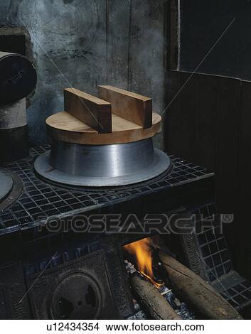 Picture - Old fashioned rice steamer. Fotosearch