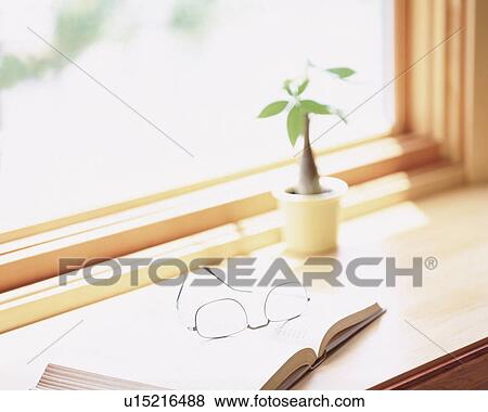 Open book and glasses by the window View Large Photo Image Stock Photo - Open book and glasses by the window. Fotosearch