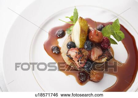 Oven roasted fruit with berry compote View Large Photo Image Stock Photograph - Oven roasted fruit with berry compote. Fotosearch