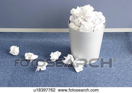 Stock Image - Overflowing trash can. Fotosearch