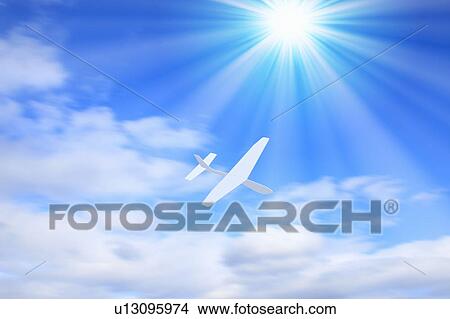 Picture - Paper airplane in sky. Fotosearch