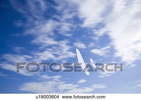 Picture - Paper airplane in sky. Fotosearch