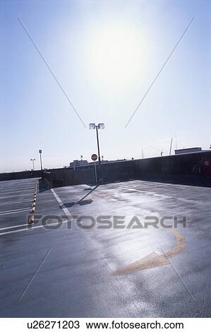 Stock Image - Parking lot after rain. Kawasaki, Kanagawa Prefecture, Japan. Fotosearch