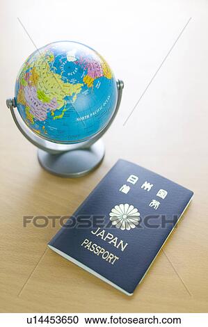 Stock Image - Passport and globe. Fotosearch