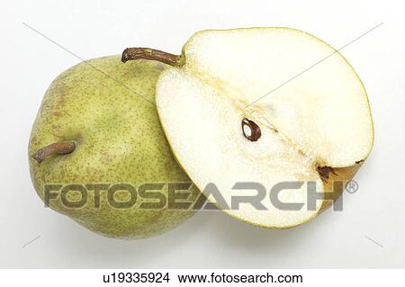 Picture - Pear sliced in half, white background. Fotosearch