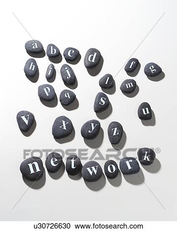Stock Image - Pebbles with letters on them spelling network. Fotosearch