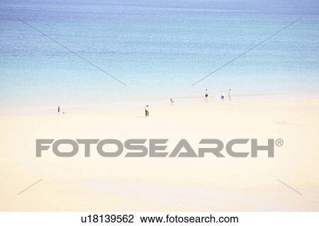 Stock Image - People in beautiful beach, England. Fotosearch