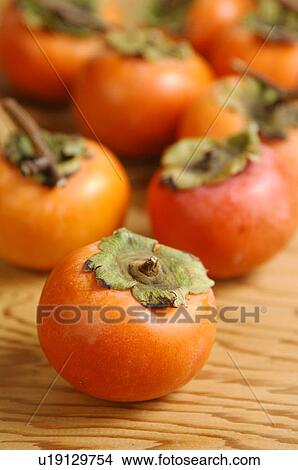 Picture - Persimmons, close up. Fotosearch