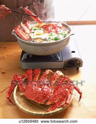 Stock Photography - Person eating crab meat dish. Fotosearch