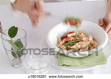Person eating pasta meal View Large Photo Image Stock Image - Person eating pasta meal. Fotosearch