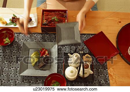 Stock Photography - Person preparing Japanese meal. Fotosearch