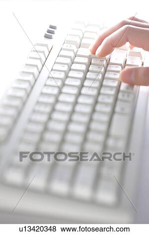 Stock Photo - Person typing on keyboard. Fotosearch