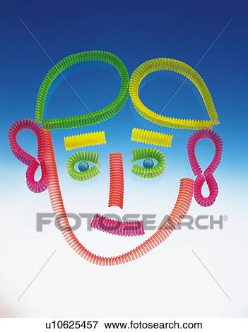 Pieces of phone cord arranged into a face View Large Photo Image Stock Photo - Pieces of phone cord arranged into a face. Fotosearch