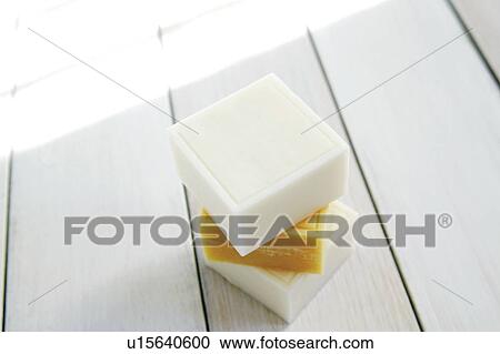 Stock Image - Pile of soaps on floor. Fotosearch