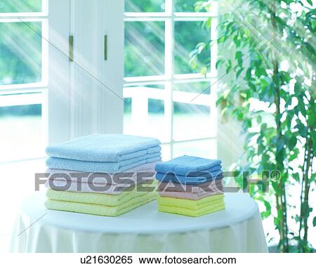 Pile of towels on table, computer graphic View Large Photo Image Stock Photography - Pile of towels on table, computer graphic. Fotosearch