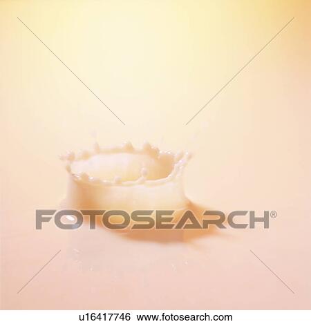 Stock Photograph - Pink liquid splashing, close up, pink background. Fotosearch