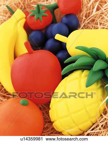 Plasticine fruit on bed of hay View Large Photo Image Stock Image - Plasticine fruit on bed of hay. Fotosearch