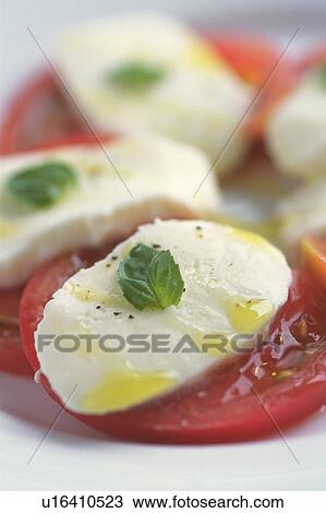 Plate of slices of tomato and mozzarella, close up View Large Photo Image Stock Image - Plate of slices of tomato and mozzarella, close up. Fotosearch