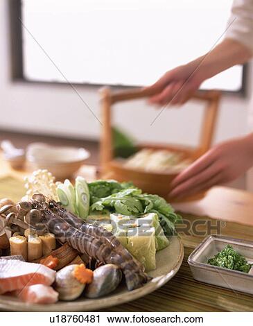 Stock Image - Plate of various vegetables and seafood. Fotosearch