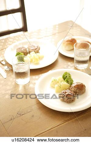 Picture - Plates of hamburger steaks. Fotosearch