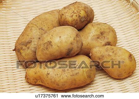 Stock Image - Potatoes in a basket. Fotosearch