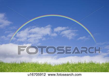 Stock Image - Rainbow over a Field. Fotosearch