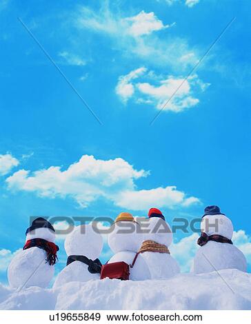 Stock Photo - Rear view of snowmen. Fotosearch
