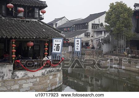 Stock Image - Restaurant on the side of river, China. Fotosearch