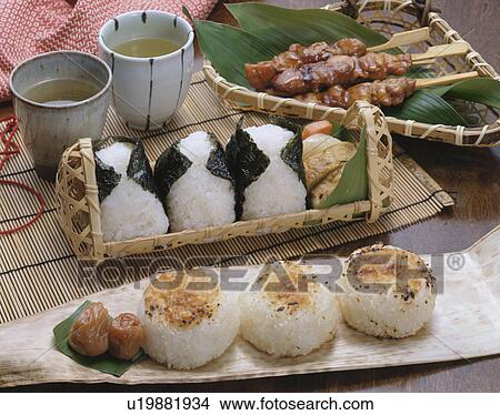 Picture - Rice ball with grilled skewered chicken. Fotosearch