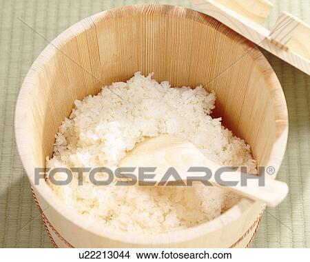 Picture - Rice in wooden tub, close up. Fotosearch