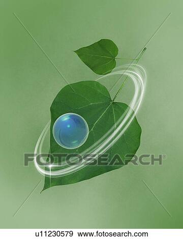 Stock Photo - Rings circling green leaves and a sphere. Fotosearch