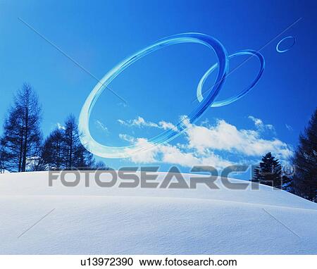 Rings floating over a snowy field View Large Photo Image Stock Image - Rings floating over a snowy field. Fotosearch