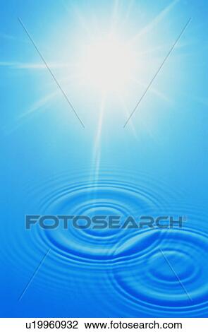 Stock Image - Rippled water surface and sun. Fotosearch