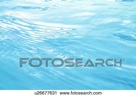 Stock Image - Rippled water surface. Fotosearch