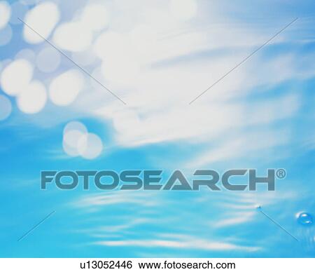Rippled water surface with lens flare View Large Photo Image Stock Photograph - Rippled water surface with lens flare. Fotosearch