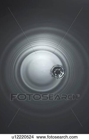 Picture - Rippled water with black background. Fotosearch