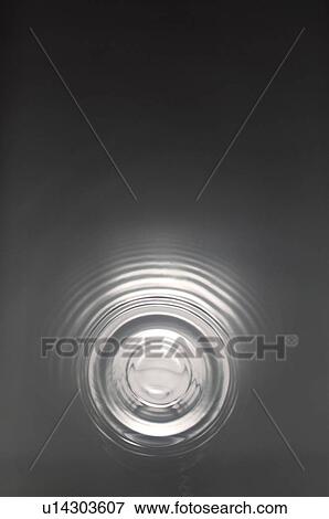 Stock Photo - Rippled water with black background. Fotosearch