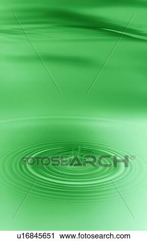 Stock Image - Rippled water with green background. Fotosearch