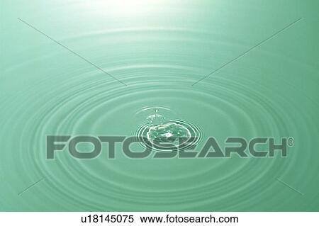 Stock Photography - Rippled water with green background. Fotosearch