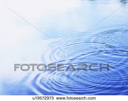 Stock Image - Ripples in water, close up. Fotosearch