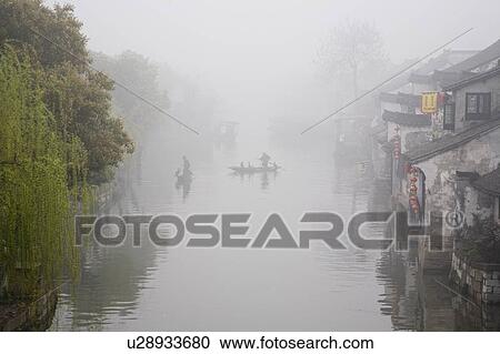 Riverside in the morning fog, Xi Tang, China View Large Photo Image Stock Image - Riverside in the morning fog, Xi Tang, China. Fotosearch